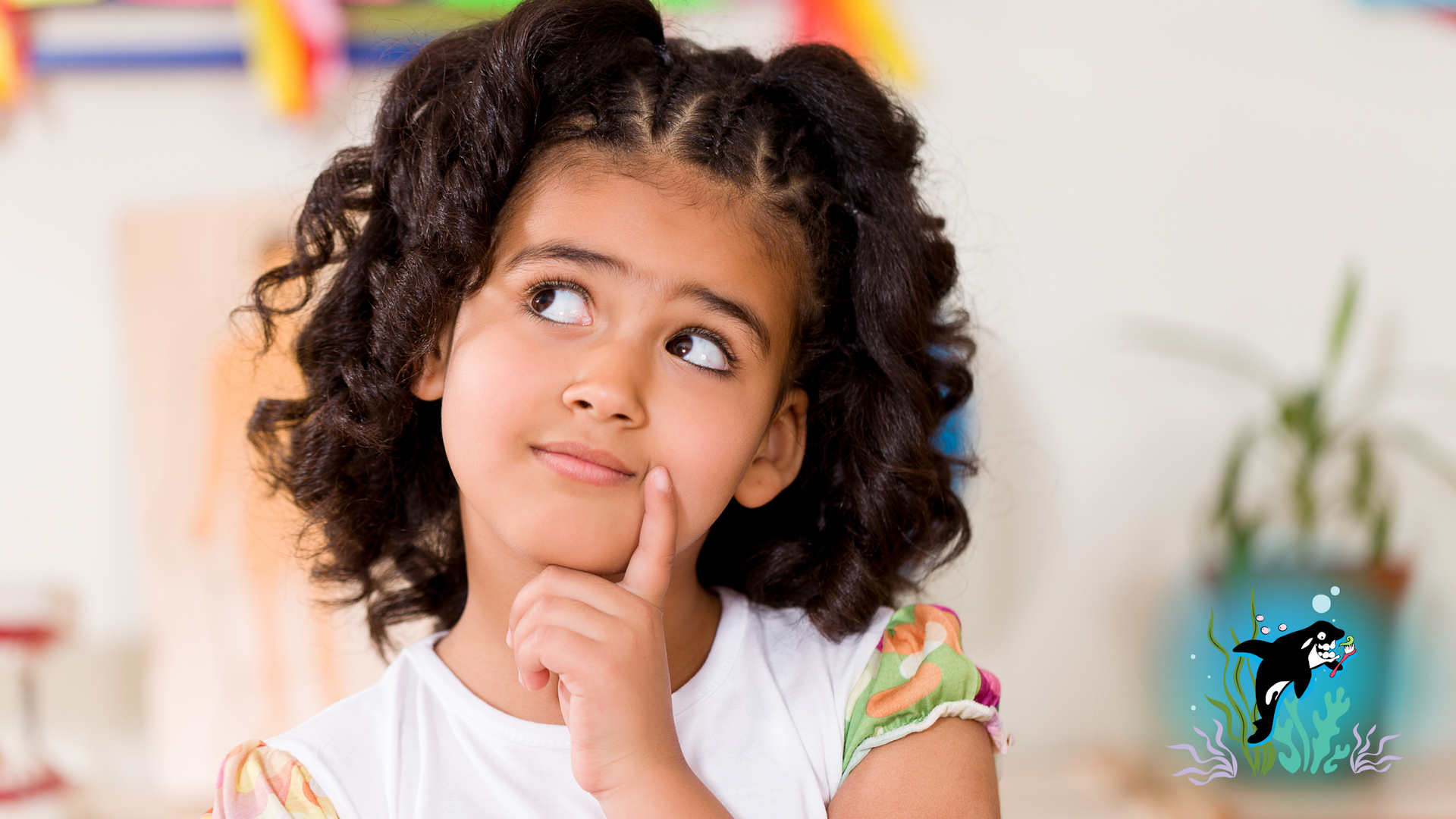 Girl looking up thoughtfully; orca illustration in the background.