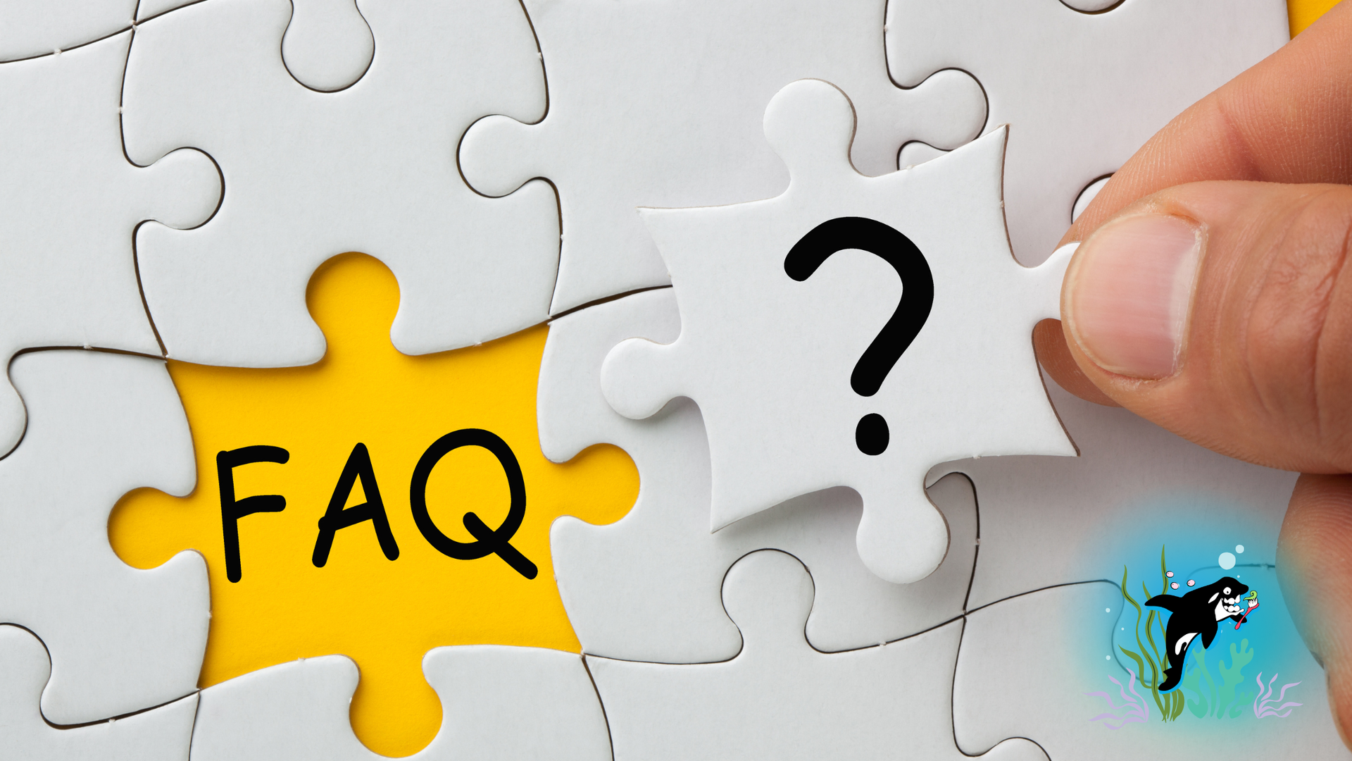 Hand placing puzzle piece with question mark into an FAQ jigsaw, yellow background.