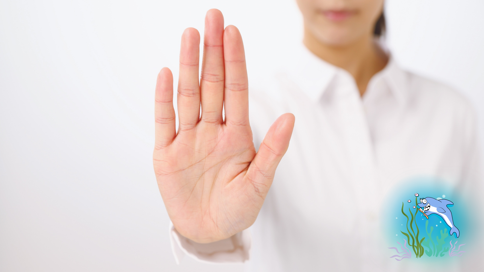 Woman's hand raised in a stop gesture, an illustration of a dolphin underwater in a blue glow.