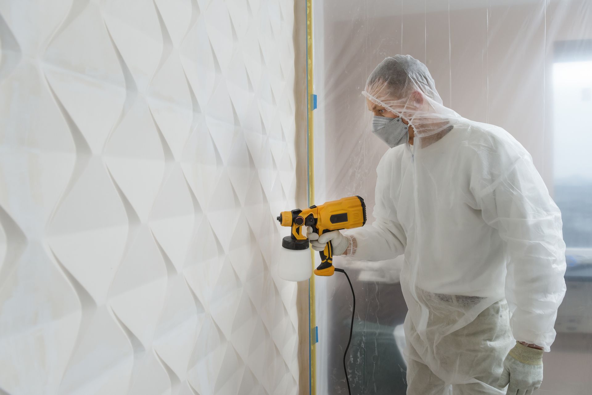 Man Doing Drywall Painting — Spokane, WA  — Interior Renovations