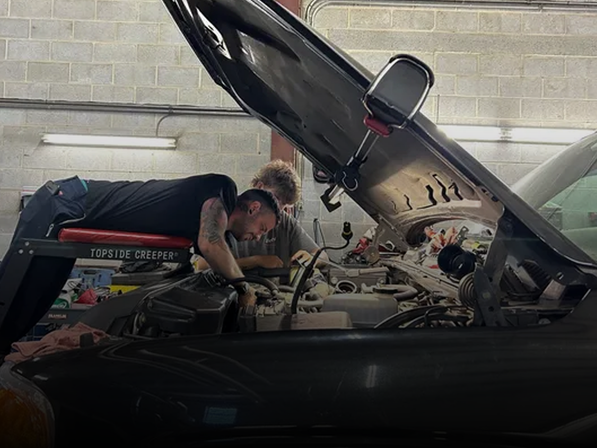 Technicians performing truck engine repair at B&G Truck & Trailer Repair shop