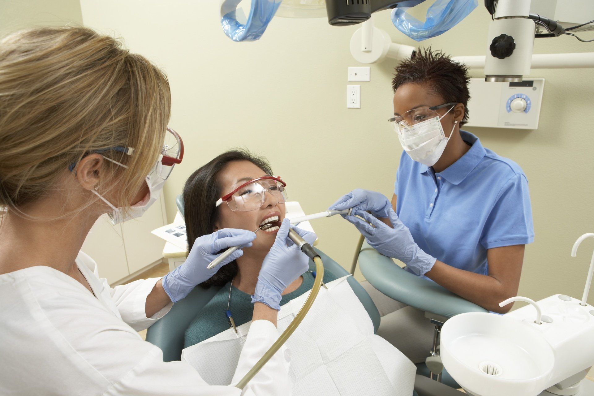 patient getting her teeth checked