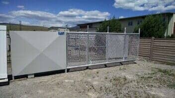 Solid Rock Automatic Gate With Barbed Wire - Grizzly Fence in Missoula, MT
