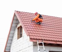worker repairing roof