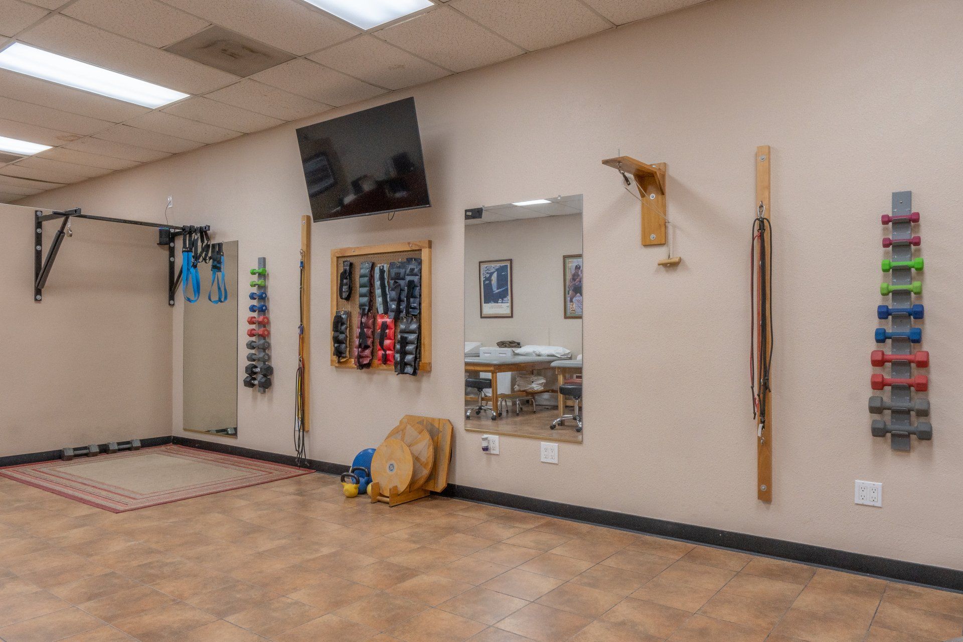 Inside view showing Dr. Mark's Herschberger's office showcasing fitness area