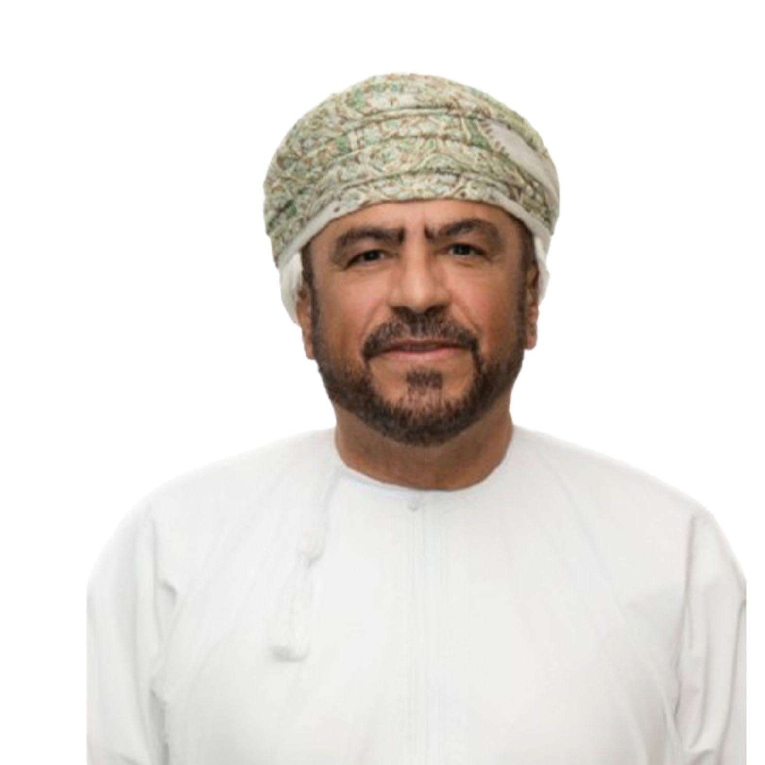 Man in traditional Omani attire, wearing a turban, smiling, neutral background.