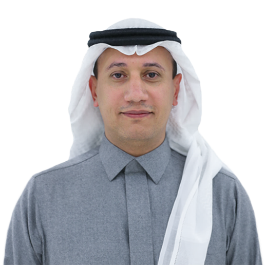 Man in traditional Arab attire, gray thobe, white headdress, smiles at the camera.