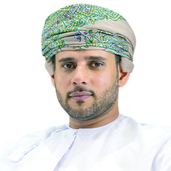 Man in traditional Omani clothing, wearing a turban, looking at the camera.