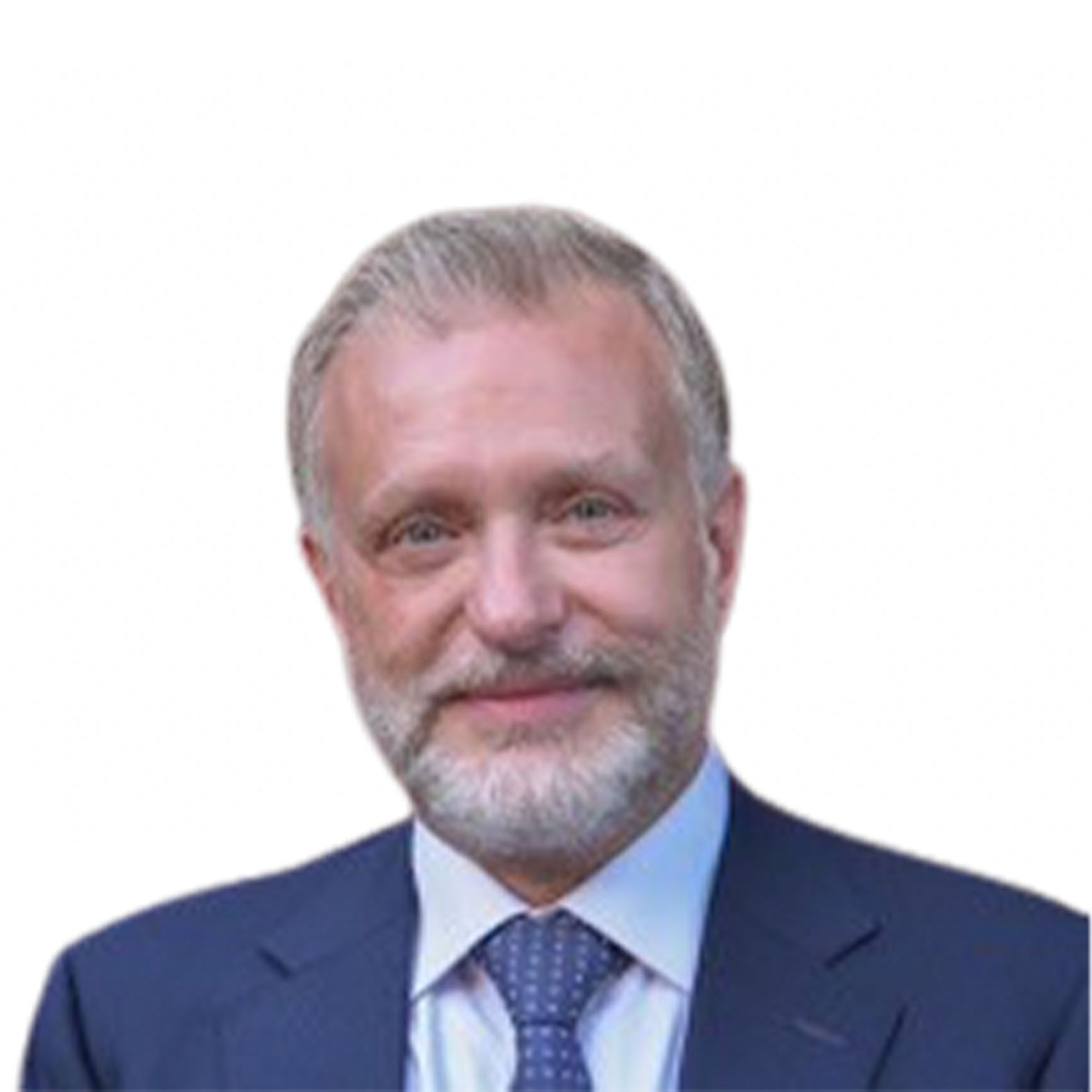 A middle-aged man with a gray beard in a suit and tie smiles at the viewer.