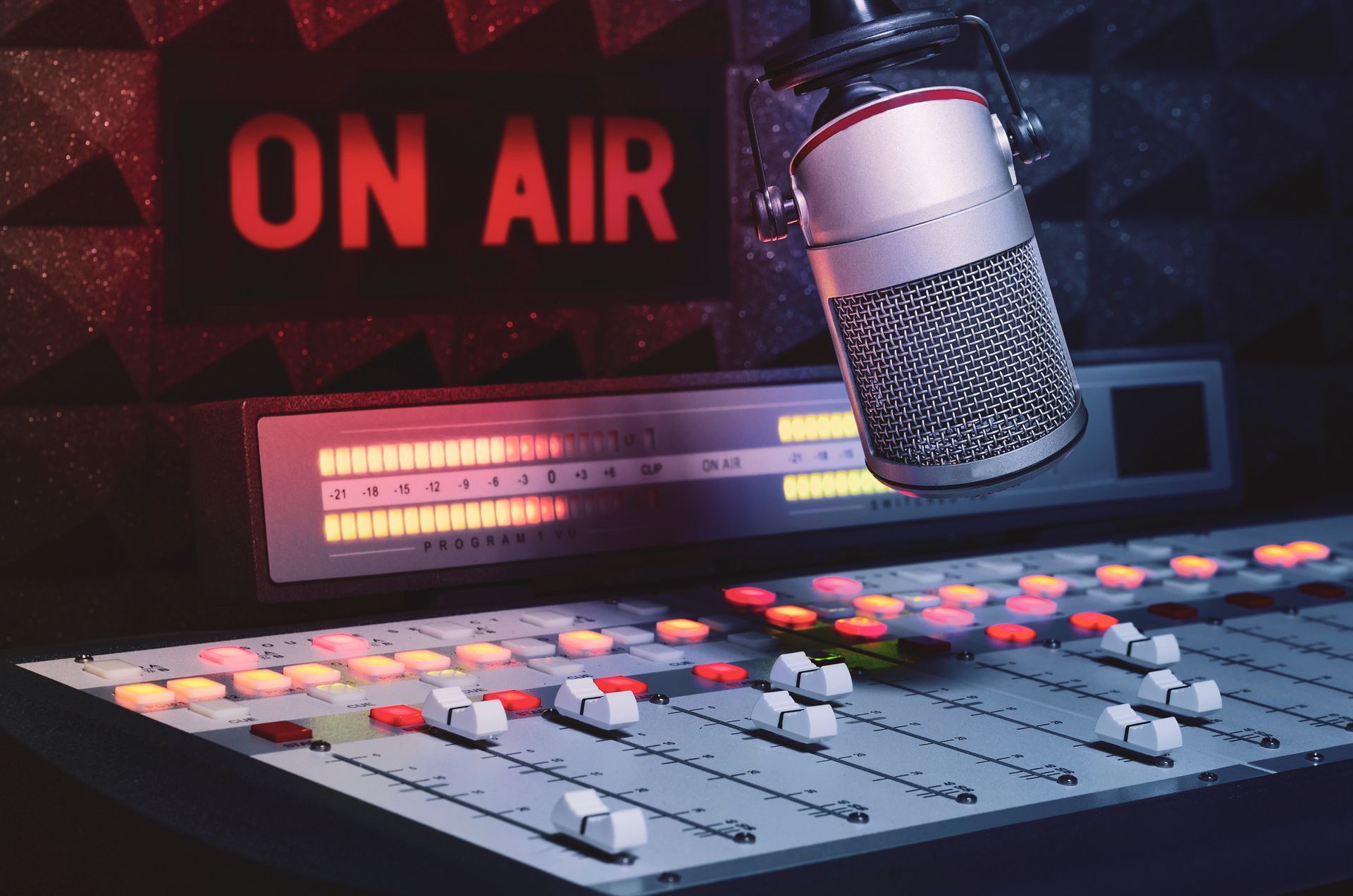 a microphone is sitting in front of a sign that says on air