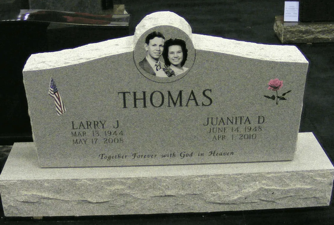 Gray granite headstone with photo of a couple, 