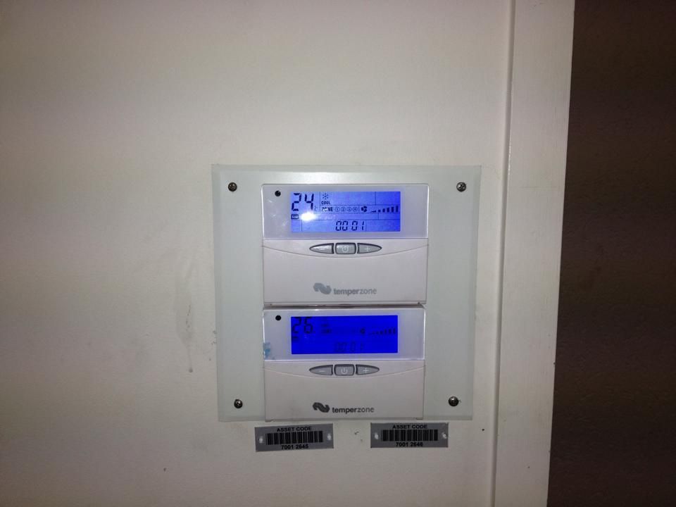 A Thermostat on a Wall Shows the Temperature is 24 Degrees — Legit Air Conditioning in Garbutt, QLD