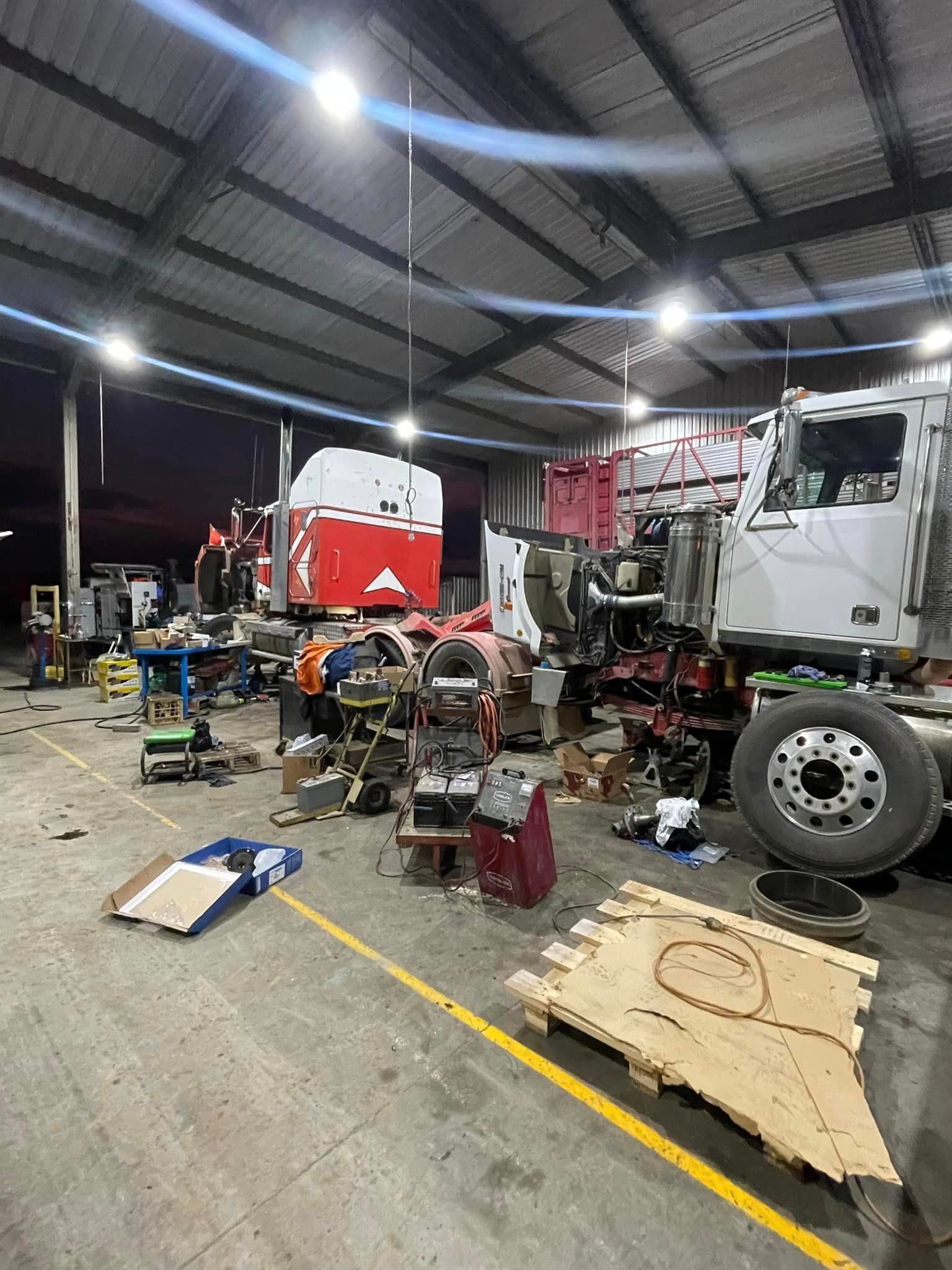 Truck on Jack Having Wheel Replaced — Superior Diesel Maintenance in Westdale, NSW