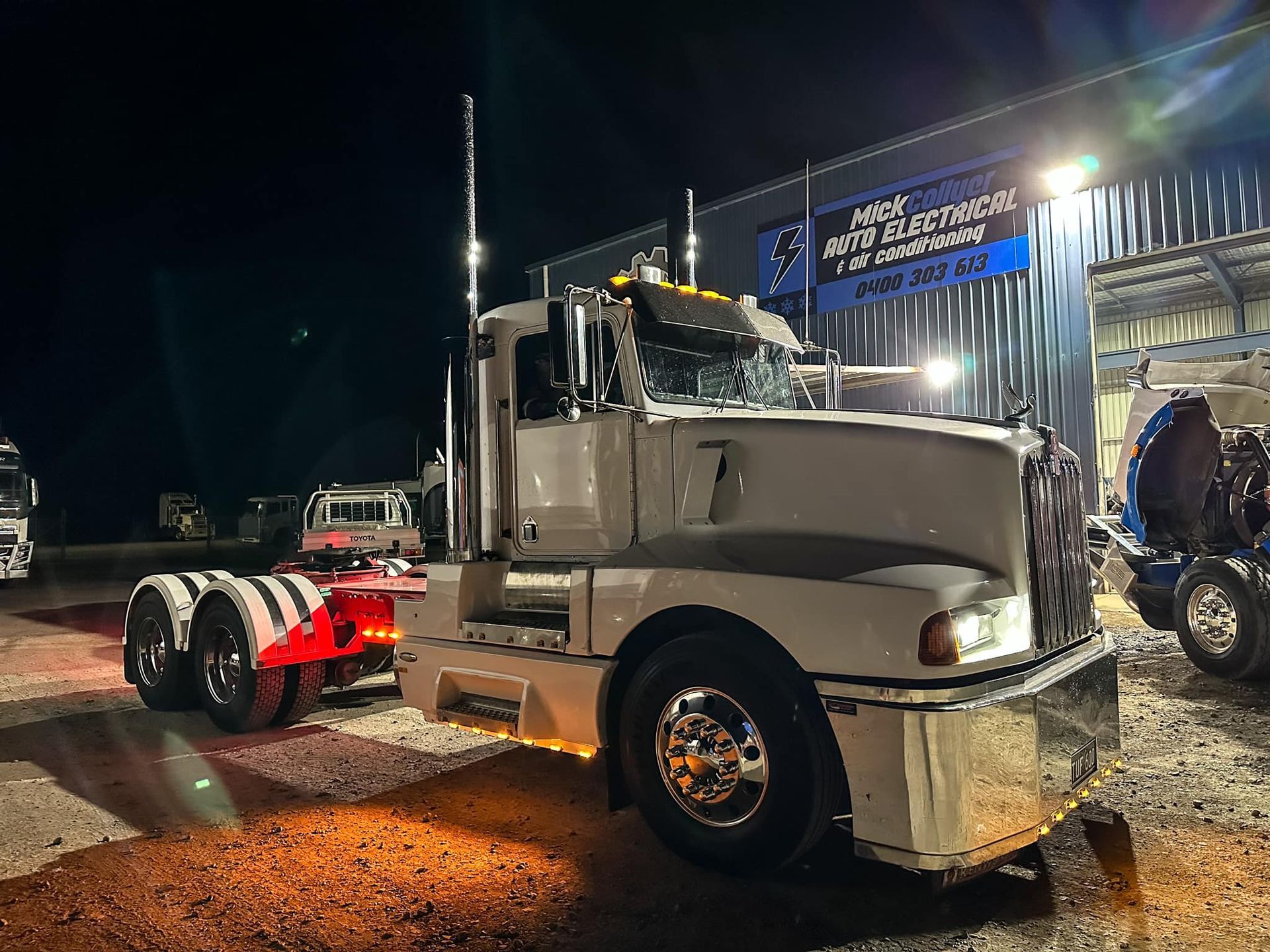 Workers Replacing Flat Tire of a Truck — Superior Diesel Maintenance in Westdale, NSW