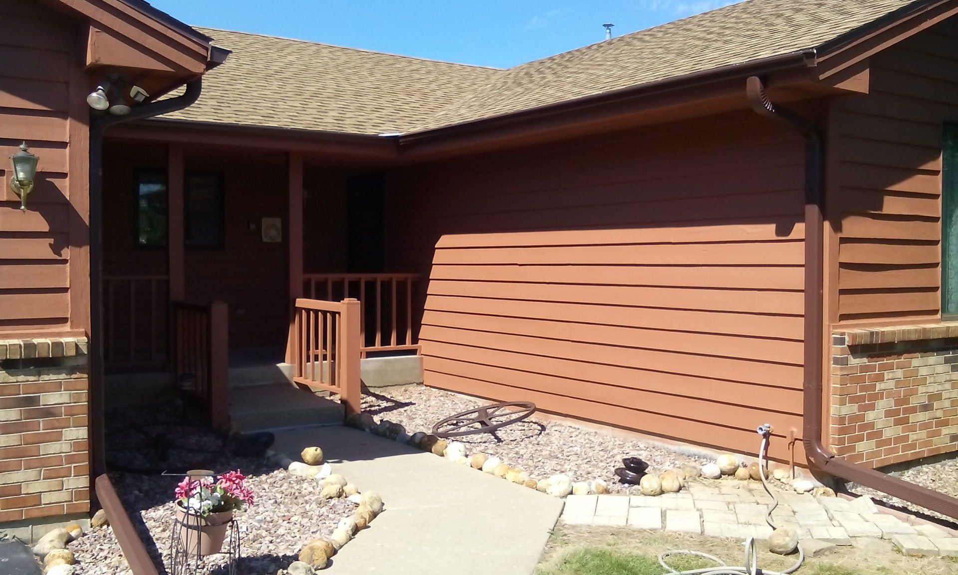 Concrete pathway and a wooden sidings