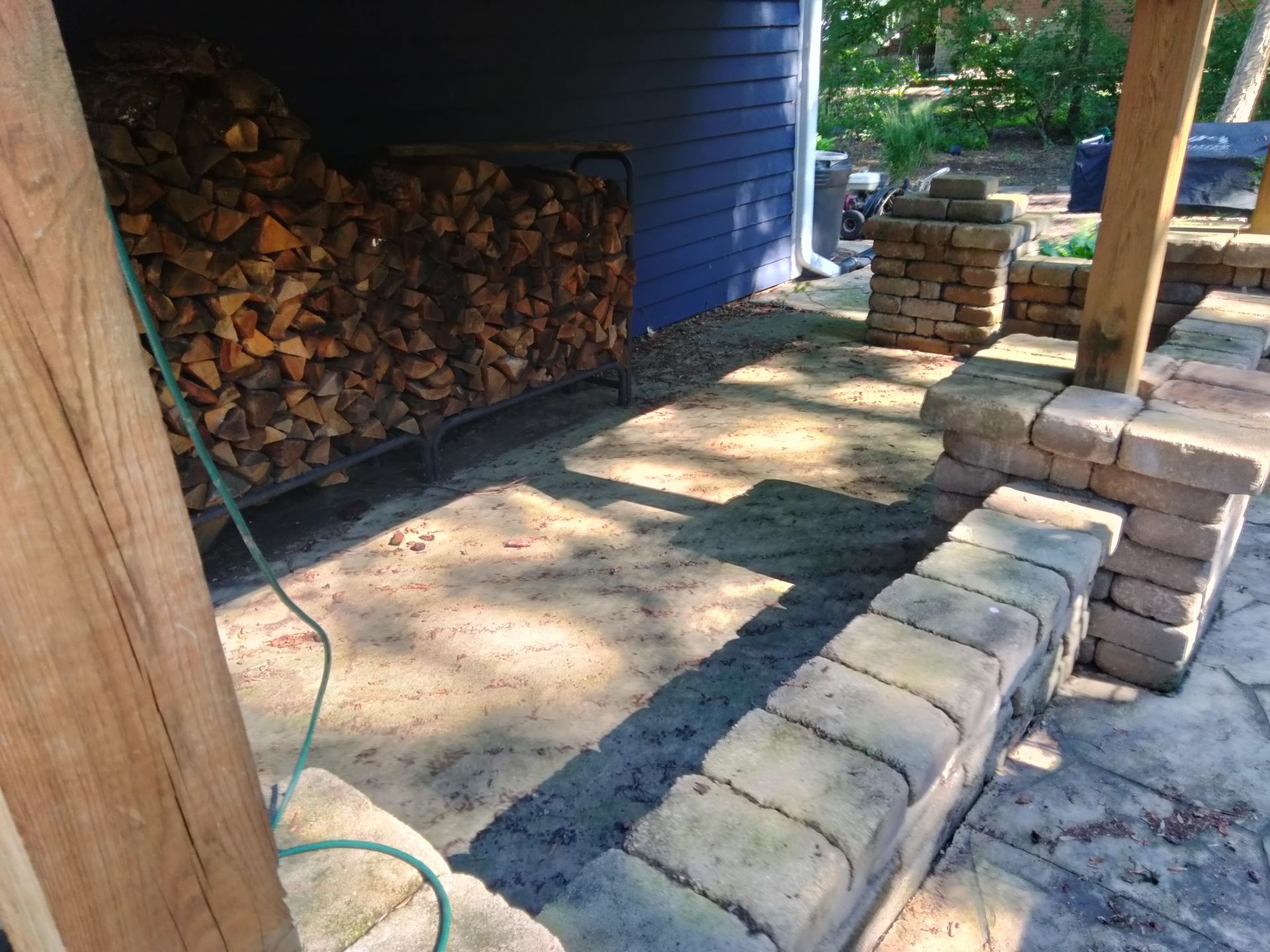 Dirty concrete floor with firewood