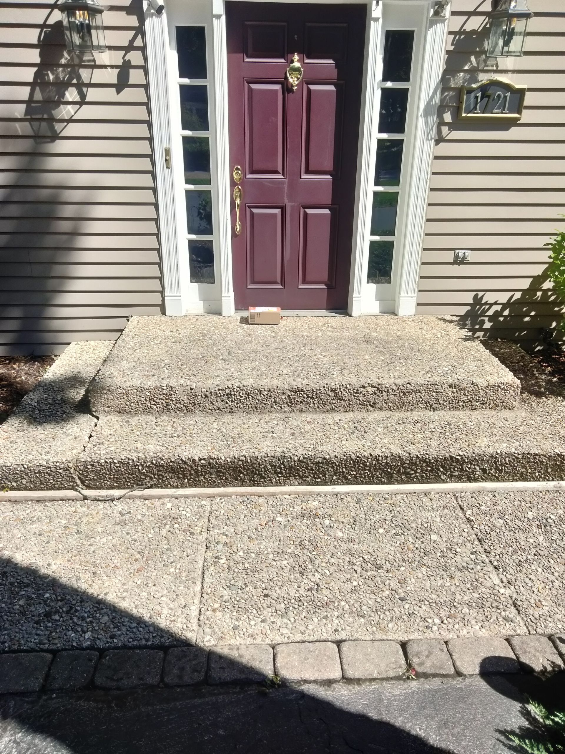 Man cleaning terrace with a power washer