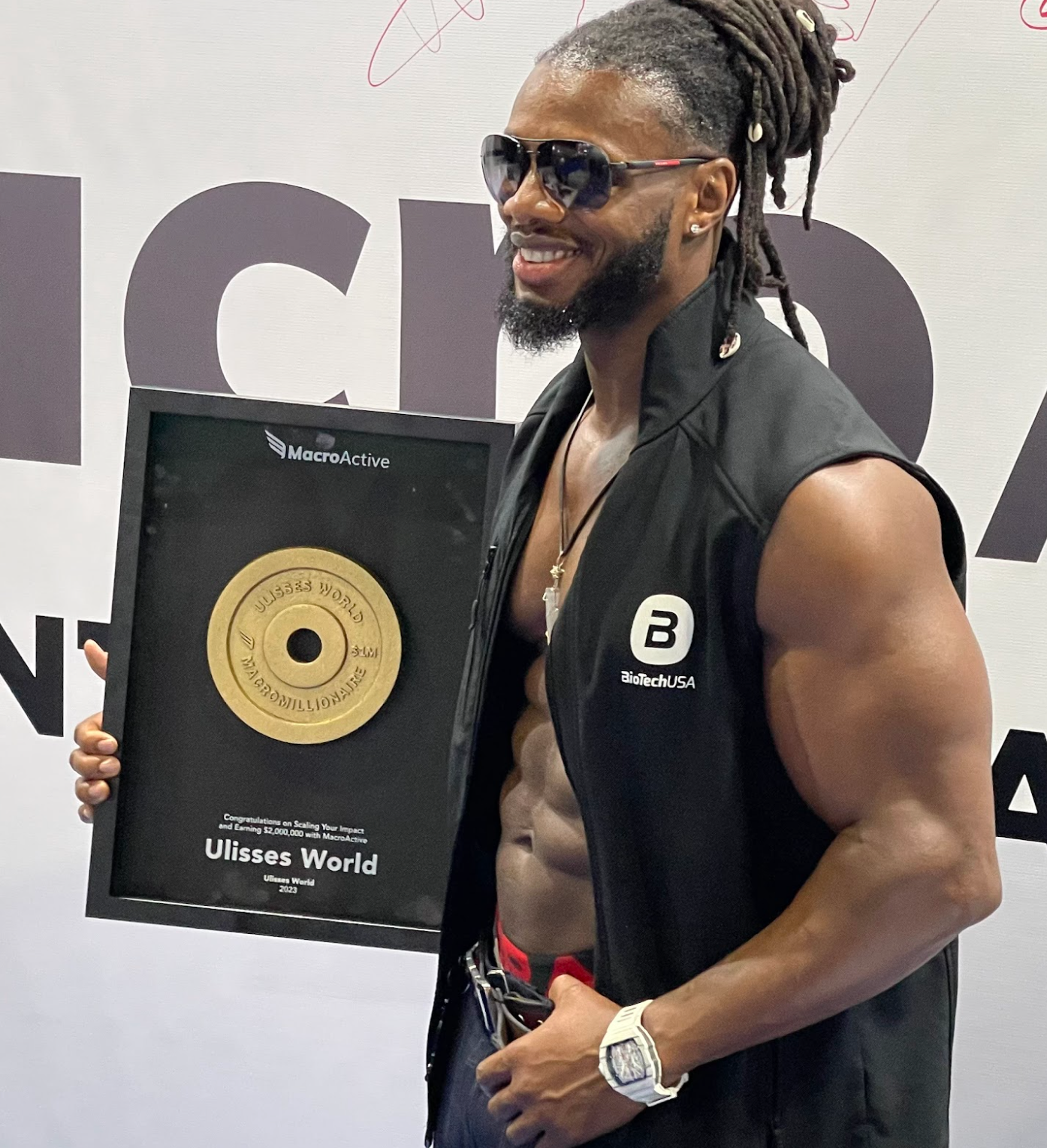 Ulisses Jr Accepting MacroMillionaire Award