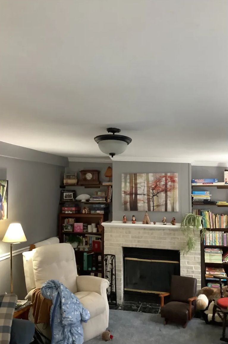 A living room with a fireplace and a couch