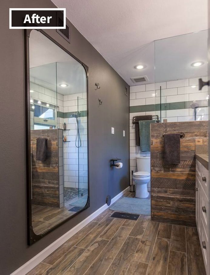 A bathroom with a large mirror and a toilet.