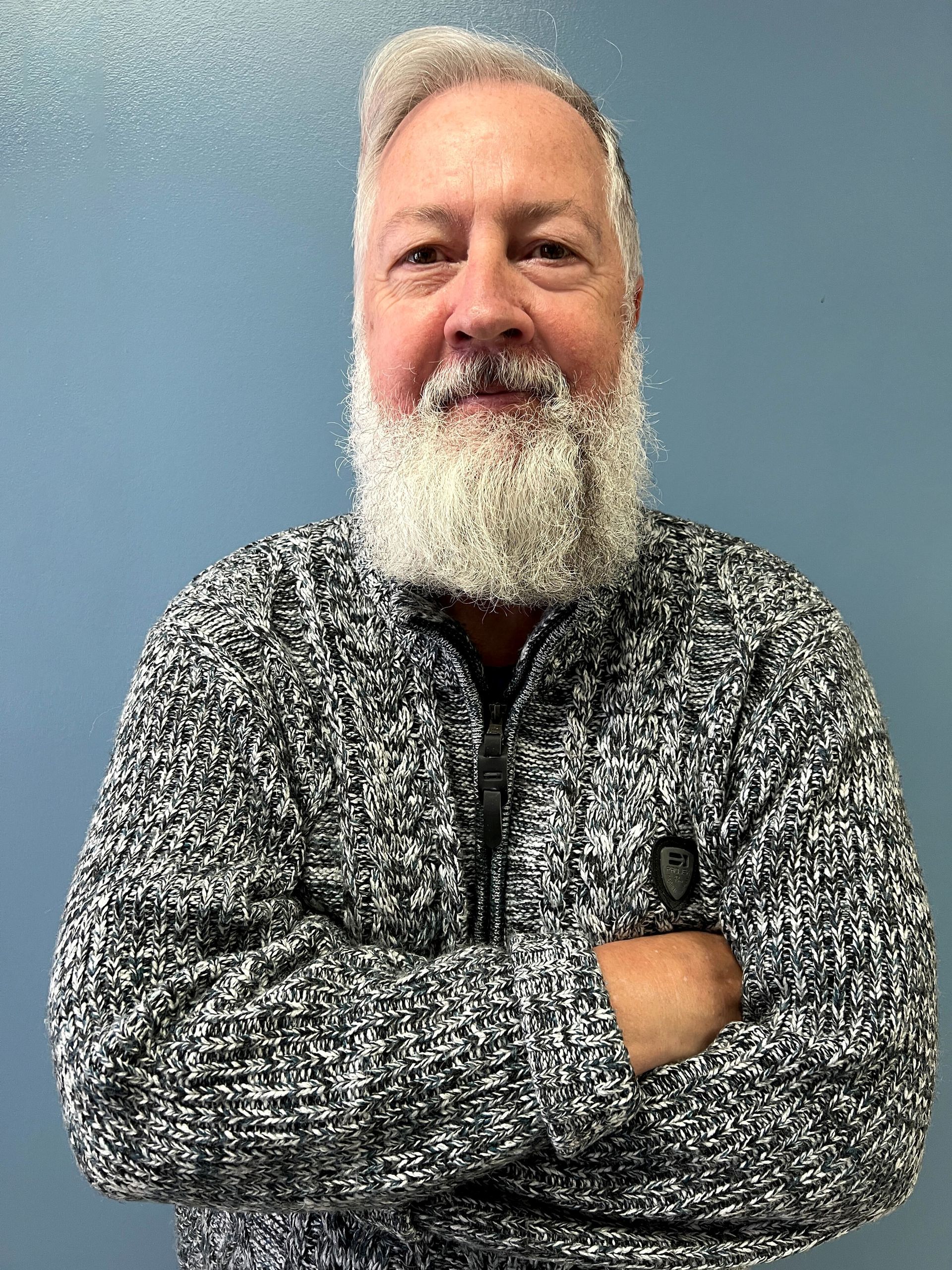 Image of Jeff Lord standing in front of plain background