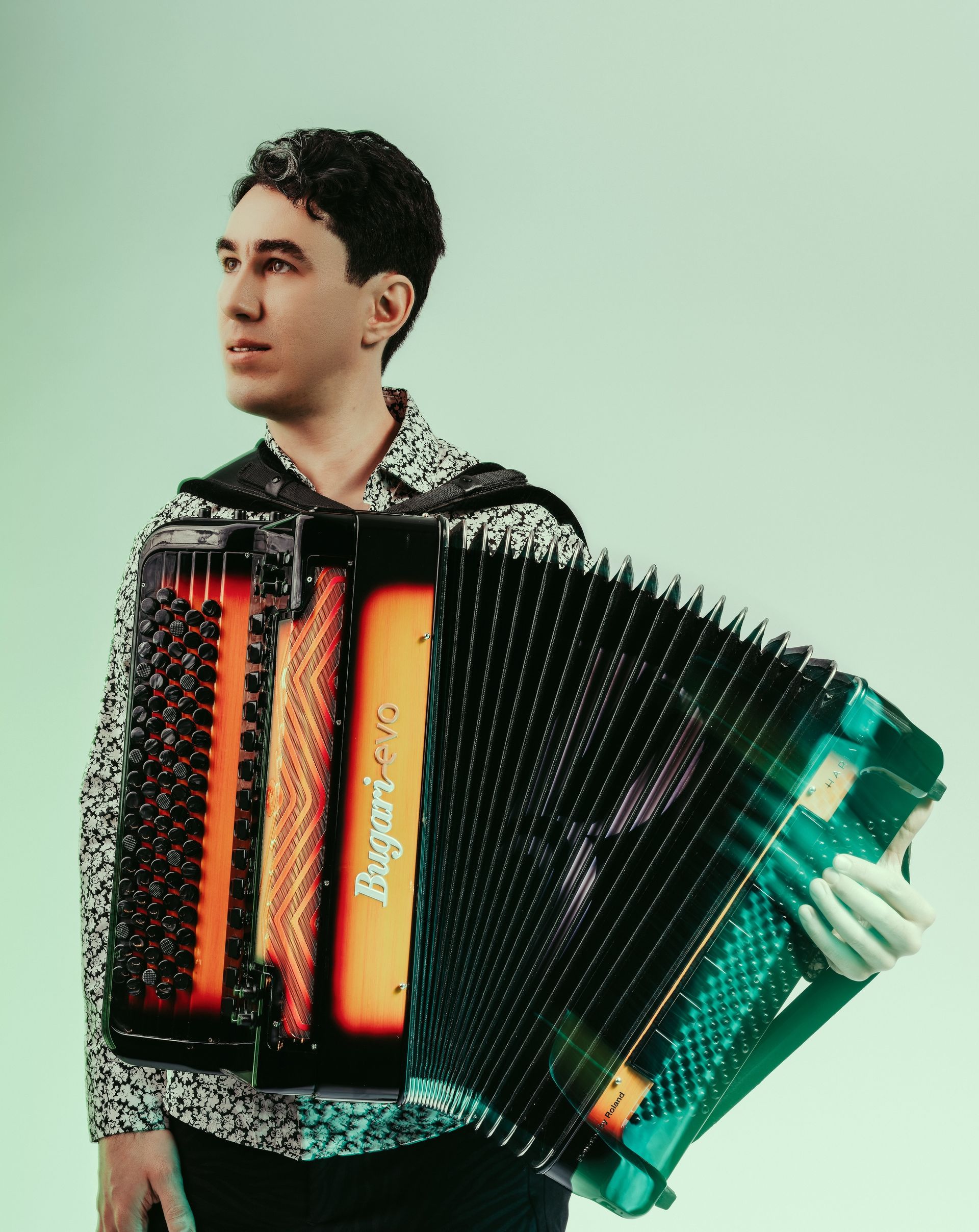 Photo of Micheal Bridge holding an accordion