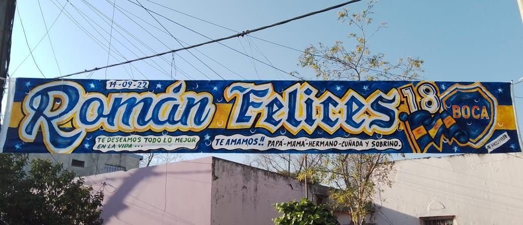 Un cartel azul y amarillo que dice 