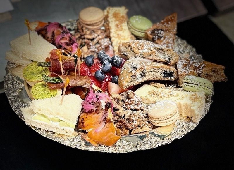 A plate of food with a lot of different types of food on it.