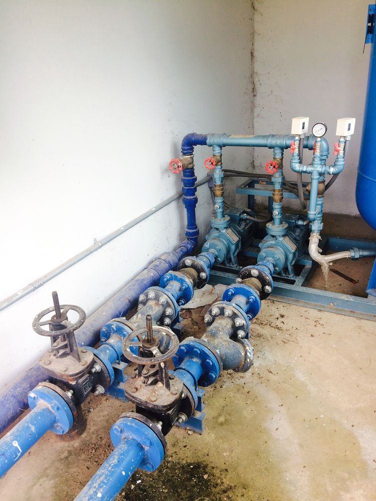 A Room Filled With Lots Of Blue Pipes And Valves — Nudges Plumbing In Dubbo, NSW