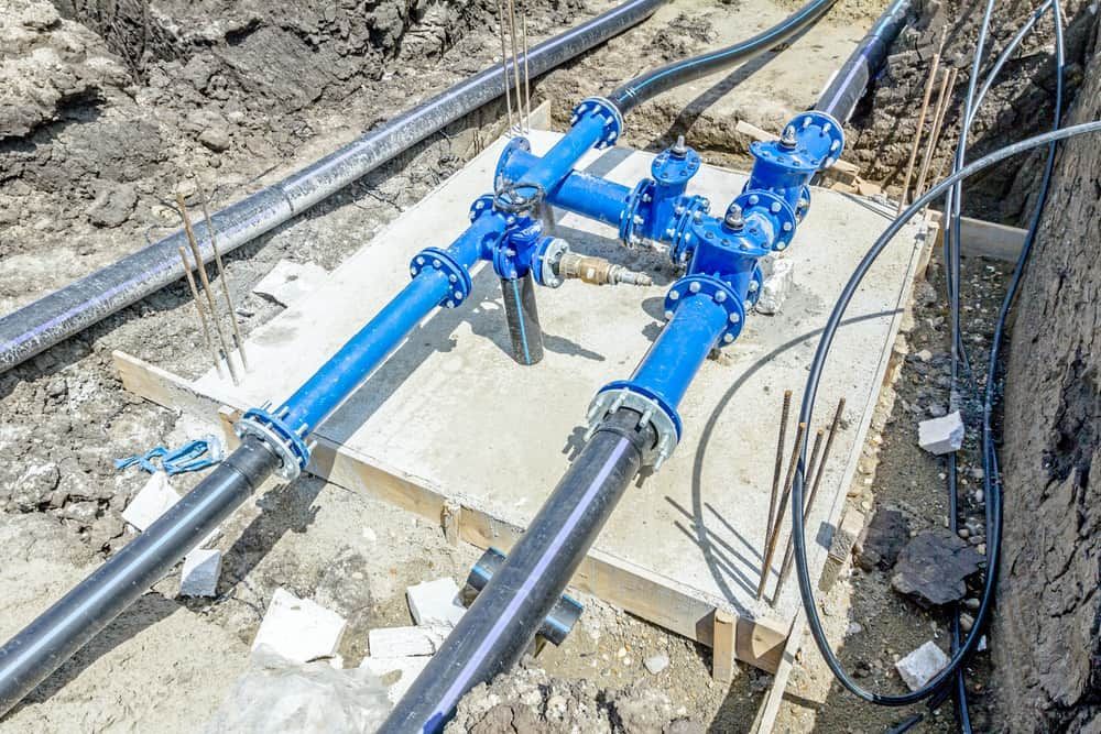 A Bunch Of Pipes Are Laying On The Ground — Nudges Plumbing In Dubbo, NSW