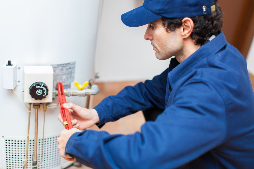 A Professional Emergency Plumber At Work