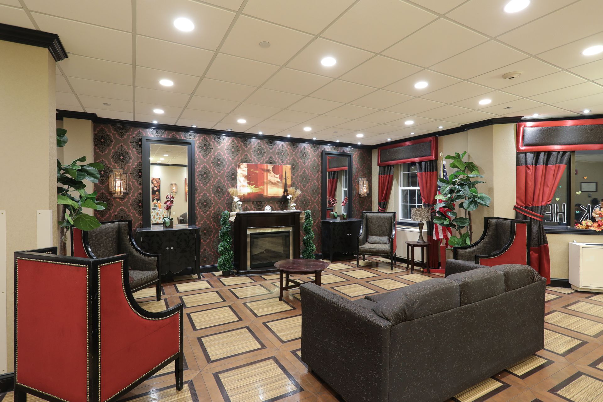 A living room with a couch , chairs and a fireplace