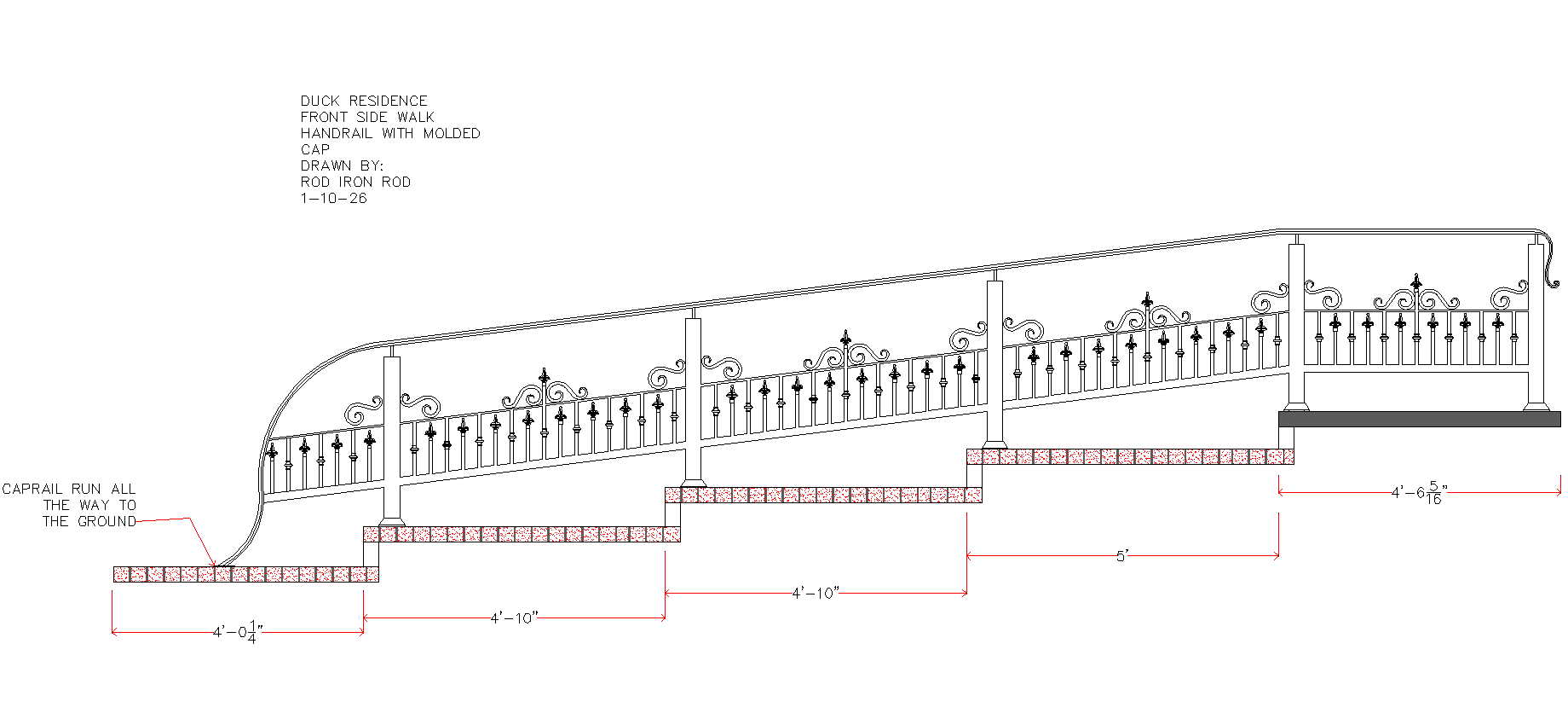 Ornate black and white wrought iron gate with decorative details and pillars.