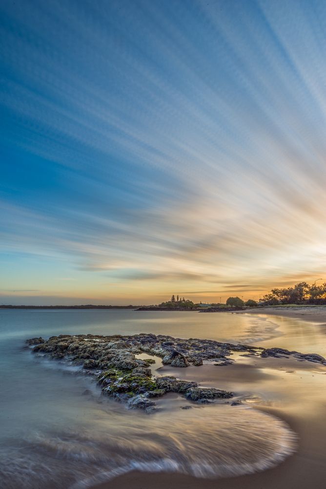 A Long Exposure Of A Beach At Sunset With A Castle In The Distance — Tweed Byron Recycling In Ballina, NSW