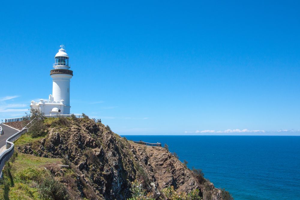 A Lighthouse Is Sitting On Top Of A Cliff Overlooking The Ocean — Tweed Byron Recycling In Byron Bay, NSW
