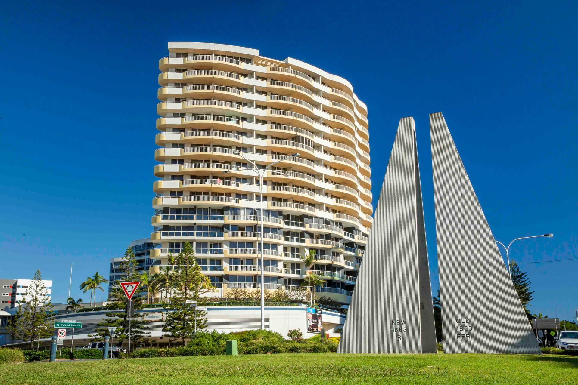 A Tall Building With A Sculpture In Front Of It — Tweed Byron Recycling In Tweed Heads, NSW