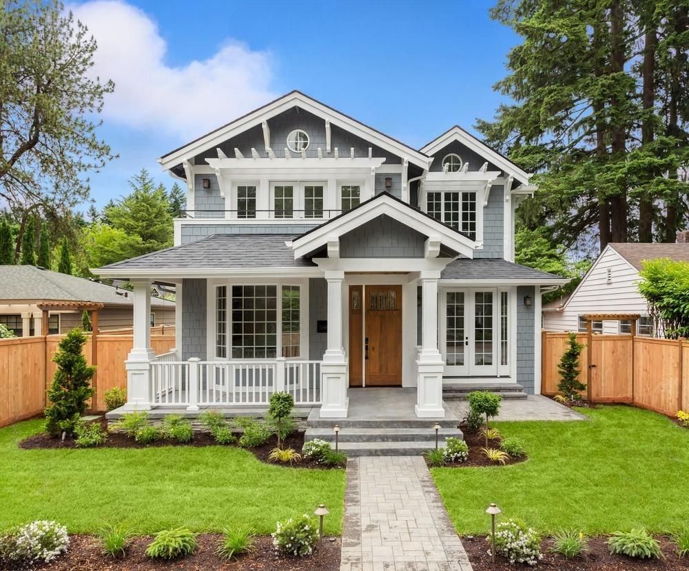 A large house with a large lawn in front of it.