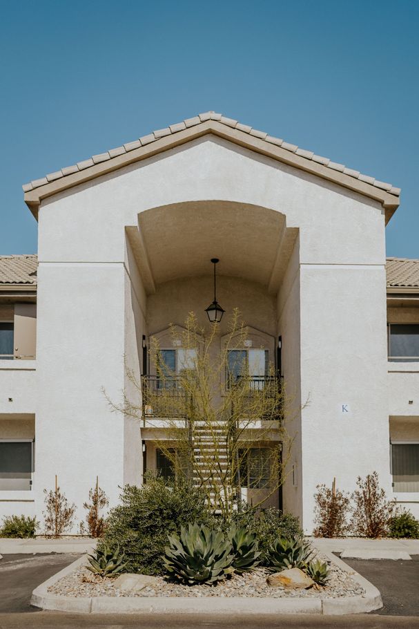 An aerial view of a residential area with lots of trees and houses.
