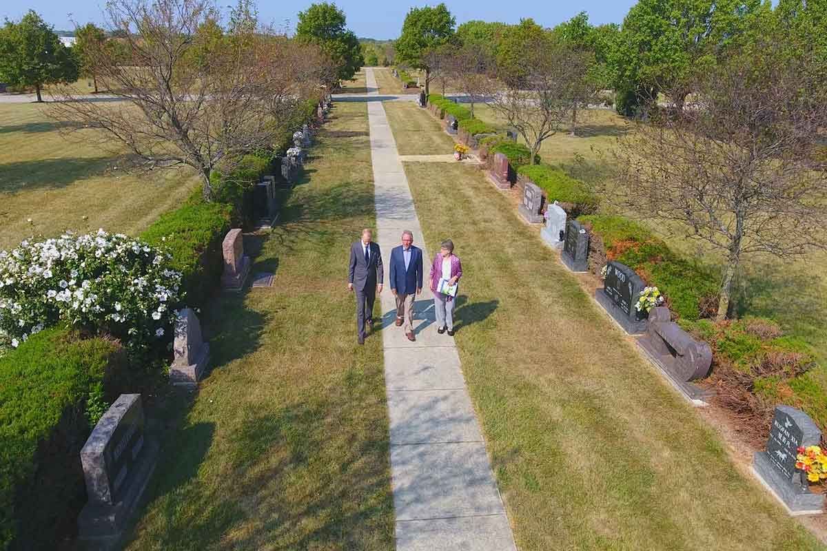 People Walking on Cemetery Path