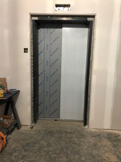 Elevator Installation Service — Elevator with Opened and Closed Doors in Newark, DE