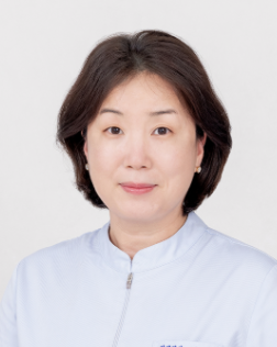 Man wearing glasses and a white lab coat; likely a doctor.