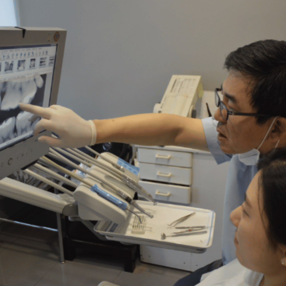 Dental tools in sterilized packages and on a tray, with a paper illustrating the instruments.