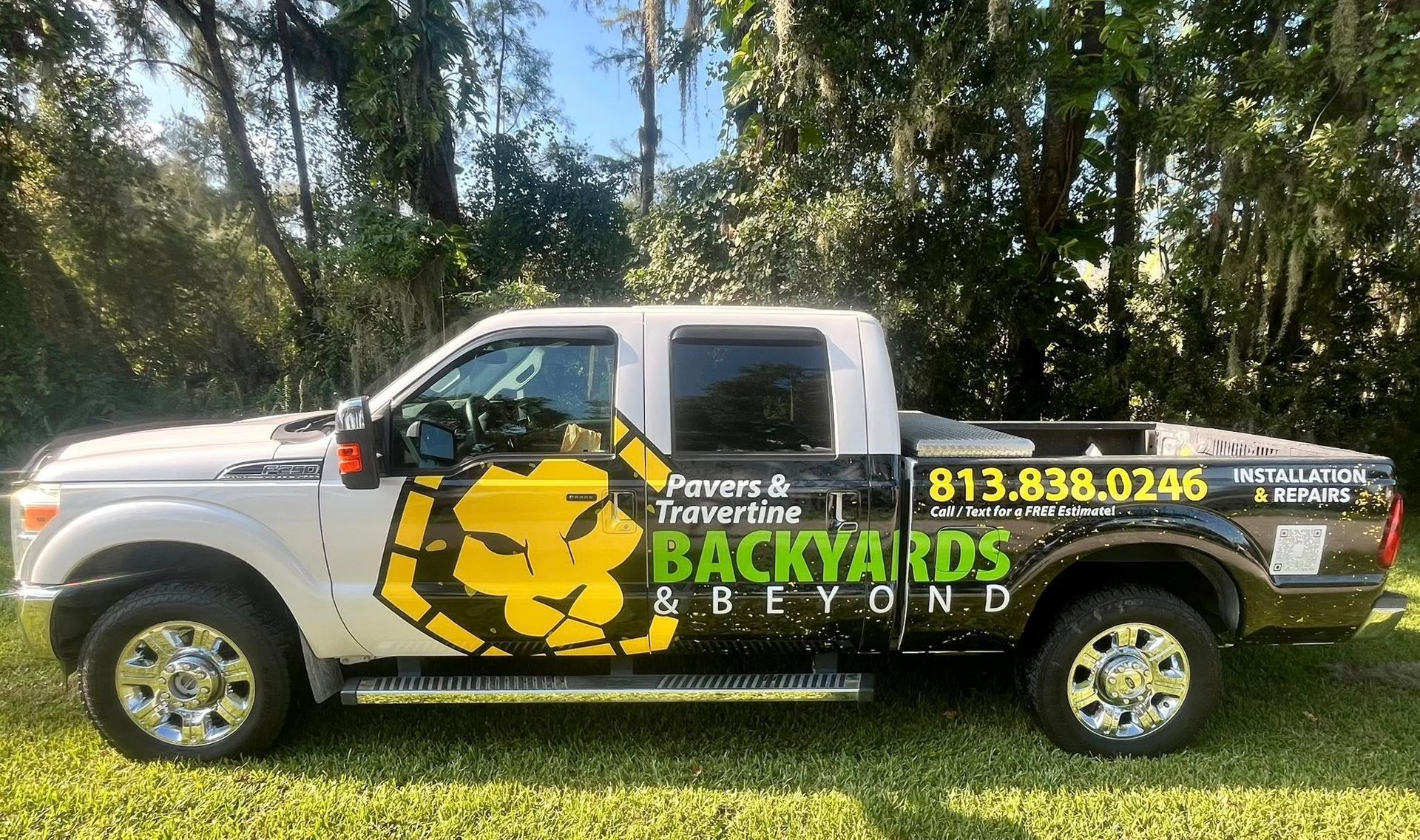 White and black truck with company logo 