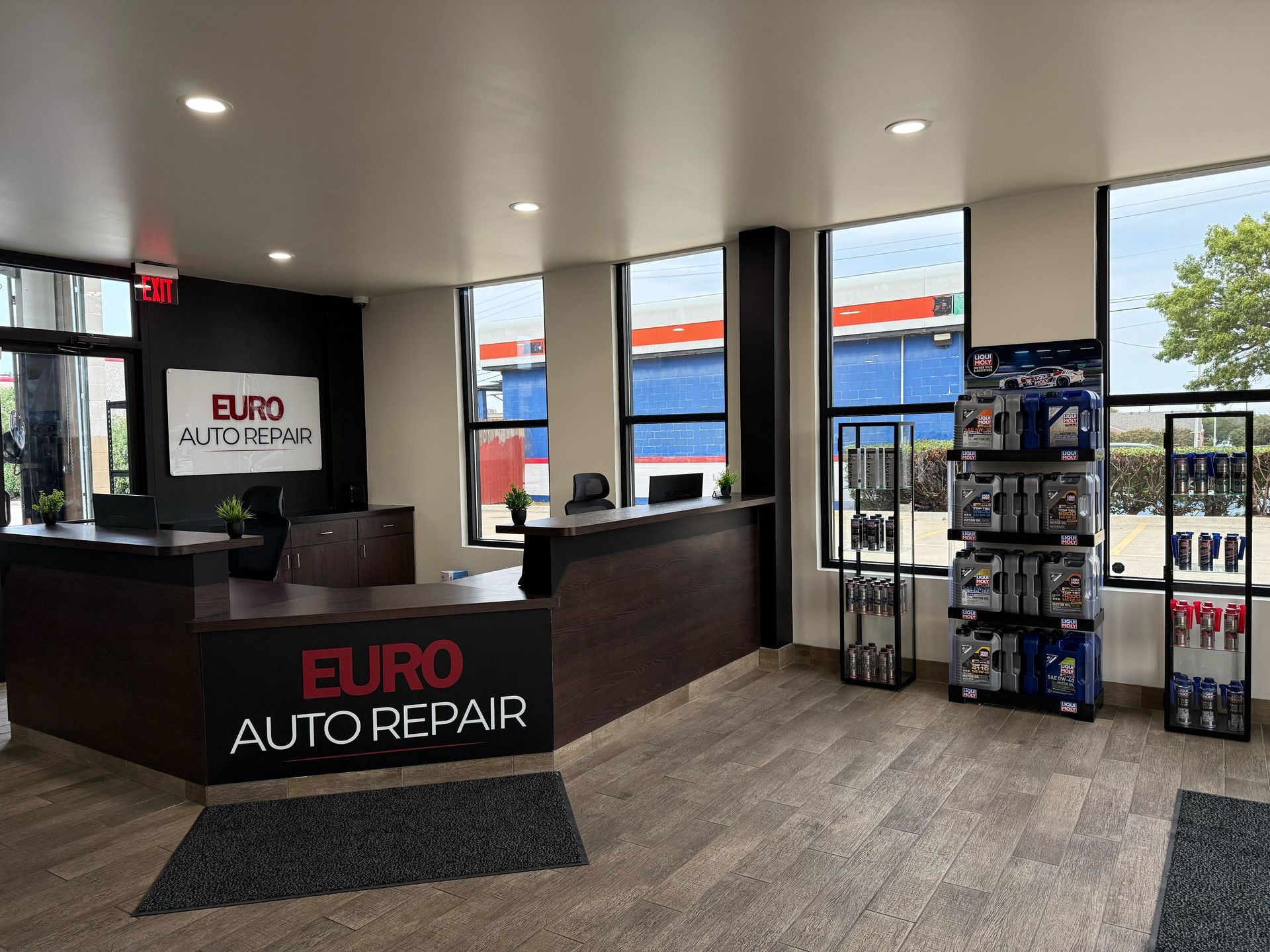 Interior of Euro Auto Repair shop with a reception desk, windows, and product displays | Euro Auto Repair