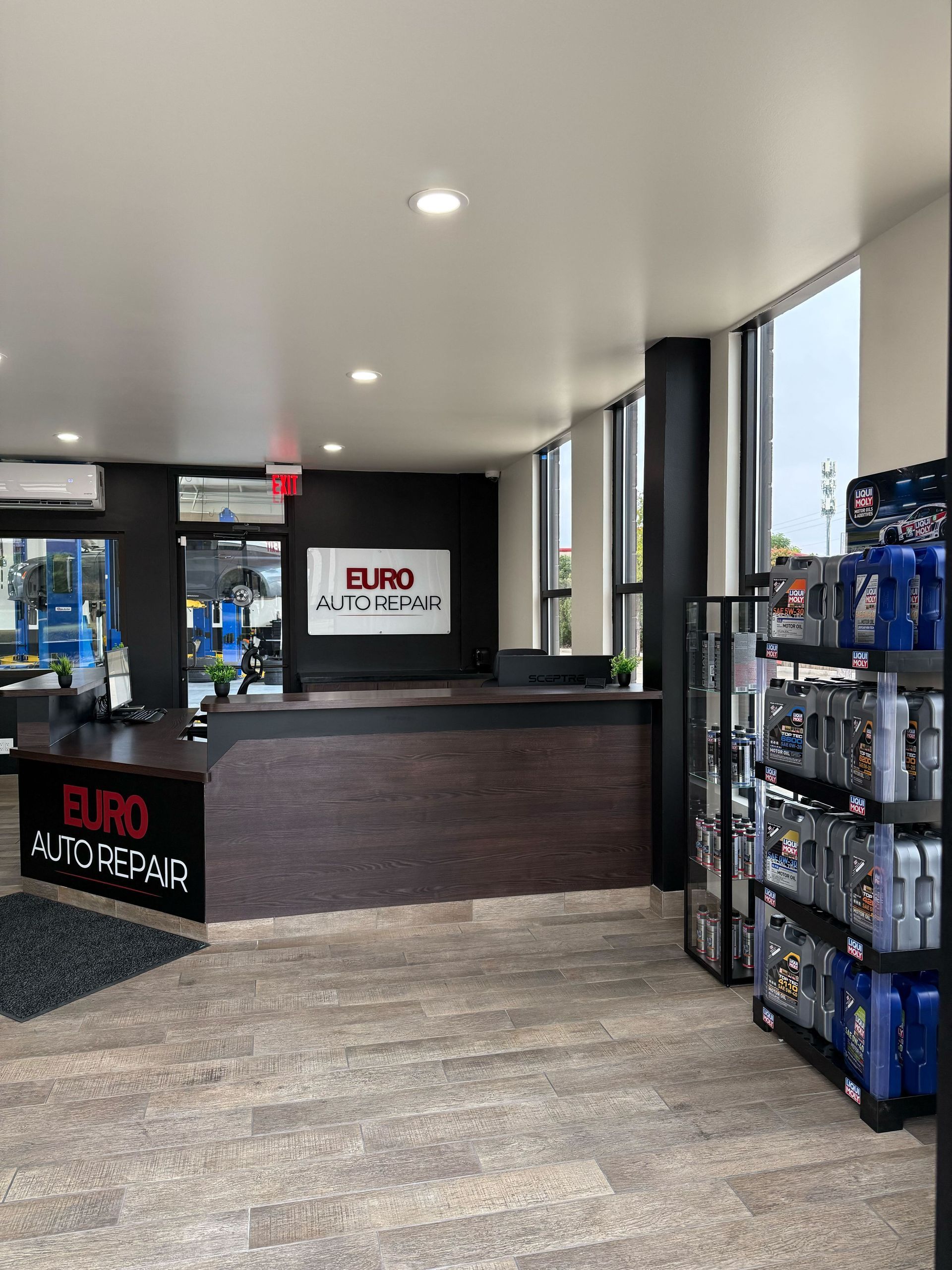 Euro Auto Repair reception area with counter, logo, and product display | Euro Auto Repair