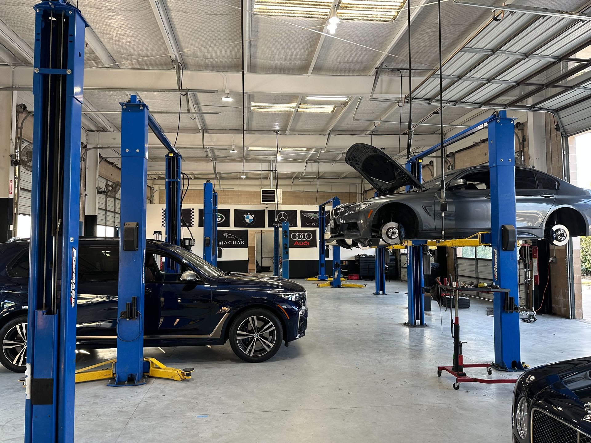 Garage interior with cars on lifts; tools and equipment visible | Euro Auto Repair