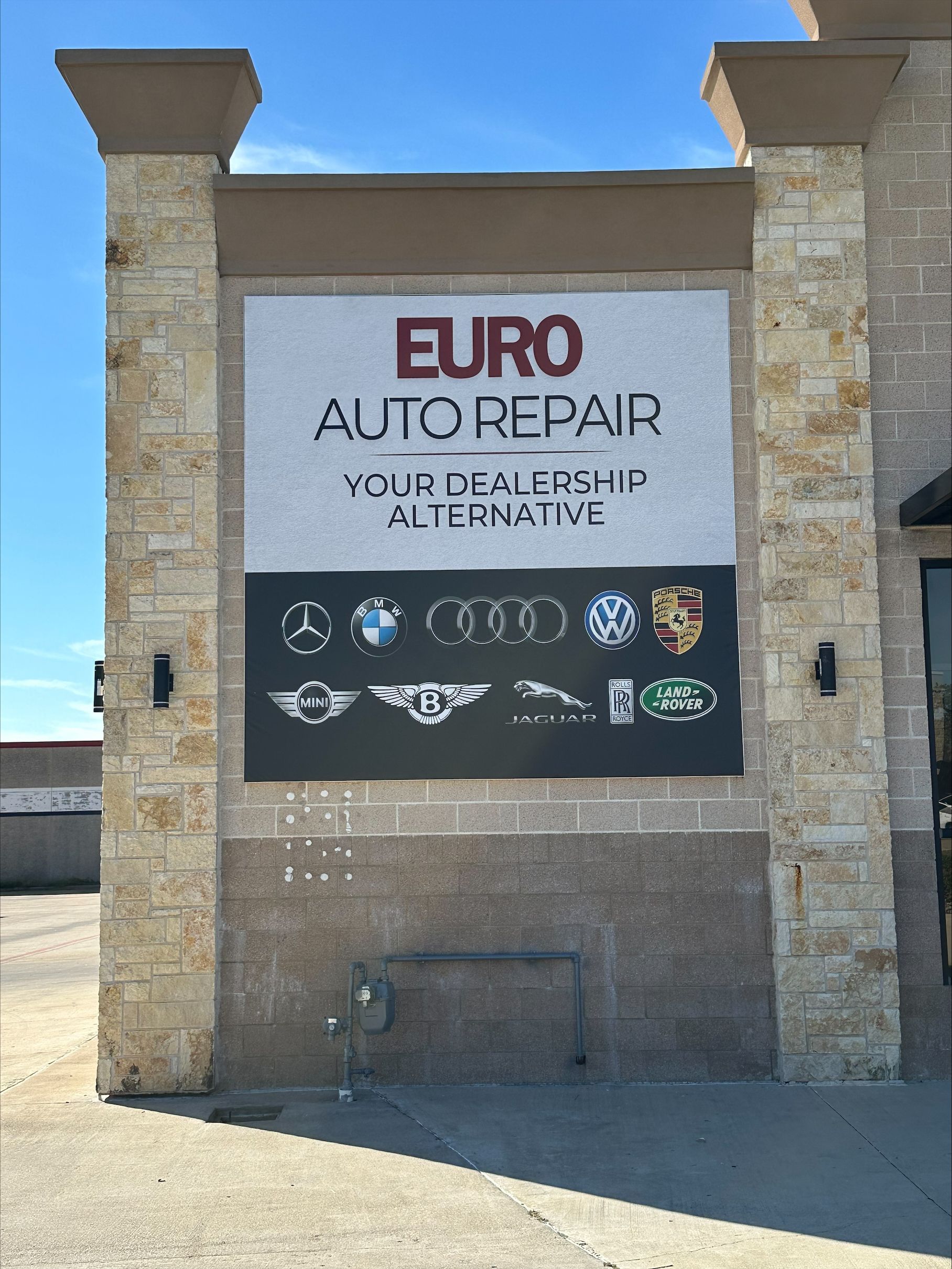 Sign for Euro Auto Repair, with logos of European car brands | Euro Auto Repair