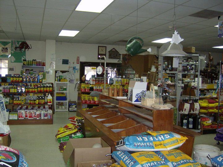 A bunch of bags of fertilizer are on display in a store