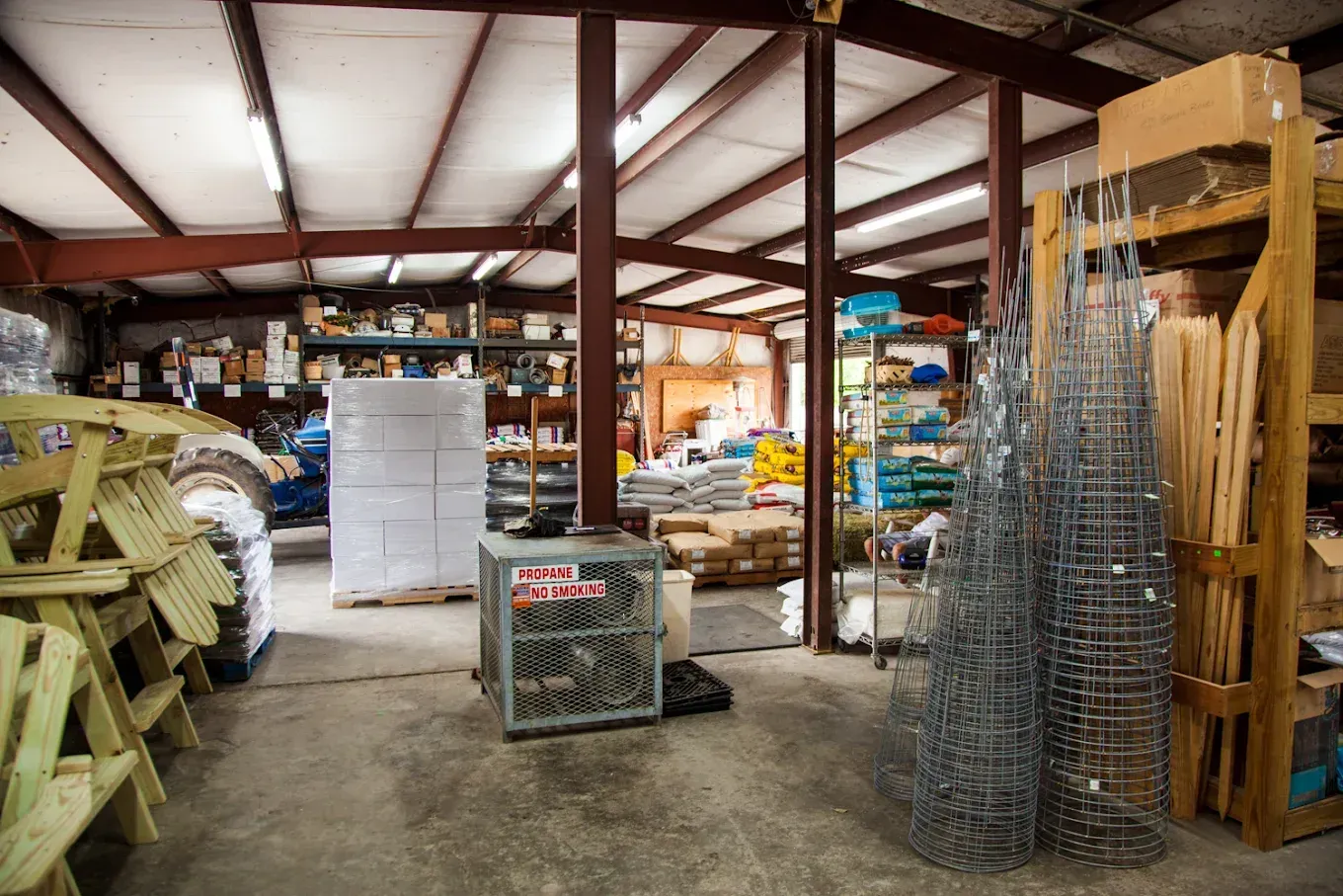 A large warehouse filled with lots of furniture and supplies.