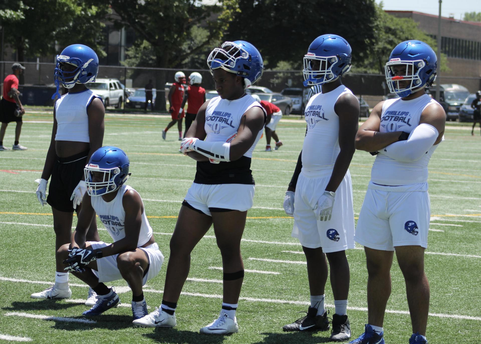A group of football players are standing on a field